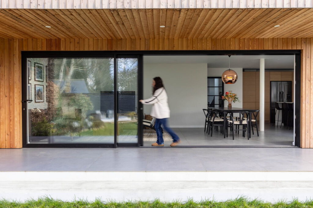 woman pushing glass windows